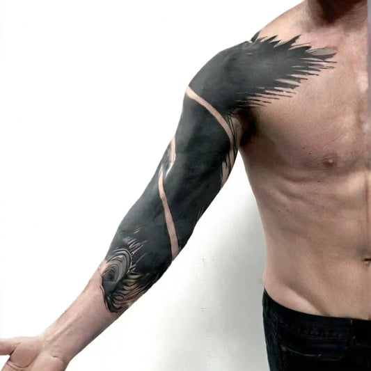 A man showing his UV black light tattoo on his arm