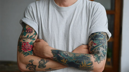 A person displaying tattoos on their arm and hand.
