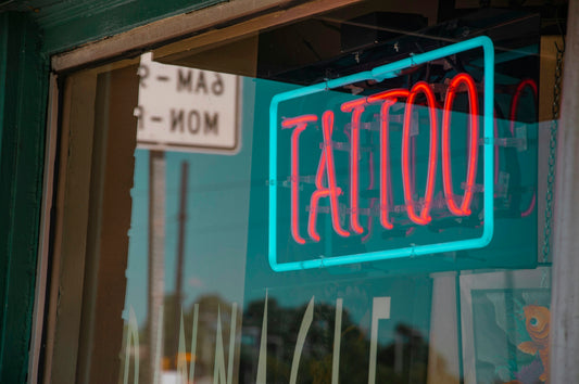 lighted red and green Tattoo neon signage